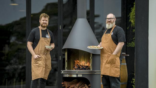 Lot 100 restaurant head chef Shannon Fleming with a high-end plates, and Tom Bubner with pizza. Picture: Roy Van Der Vegt