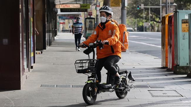 A Menulog delivery rider is seen in Sydney. Sole traders are currently not required to accumulate superannuation. Picture: NCA NewsWire / Dylan Coker