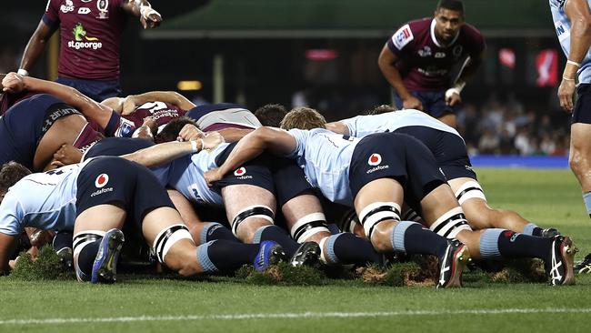 Players create large divots in the turf during a scrum during the clash between the Waratahs and Reds.(Photo by Ryan Pierse/Getty Images)