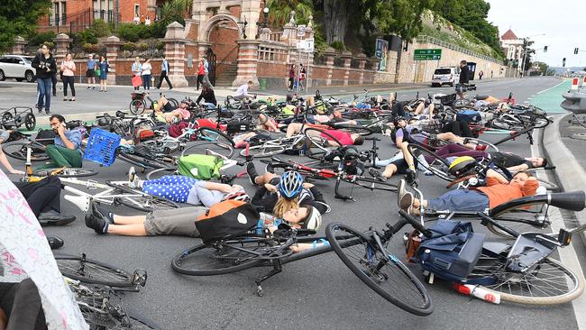 Cyclists block traffic during a 'die-In' protest. Picture: AAP.