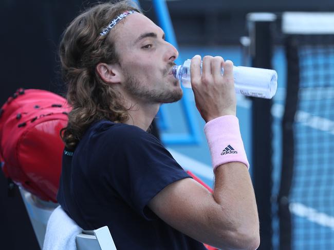 Stefanos Tsitsipas takes a sip from his water bottle during a practice session. Picture: AAP