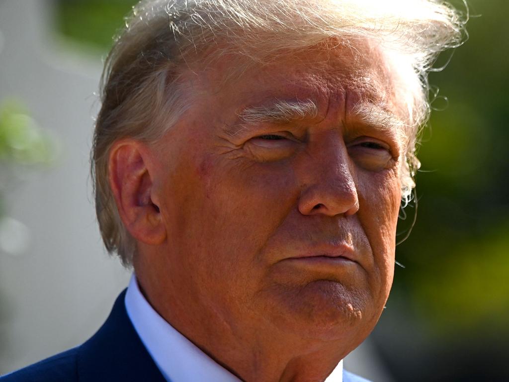 Former US President Donald Trump leaves a polling station after voting in the US midterm elections in Florida. Picture: Eva Marie Uzcategui / AFP