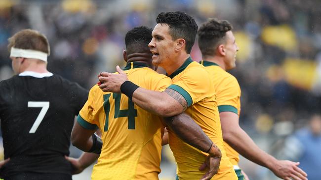 Filipo Daugunu of the Wallabies celebrates with Matt To'omua of the Wallabies after scoring a try. Picture: Getty