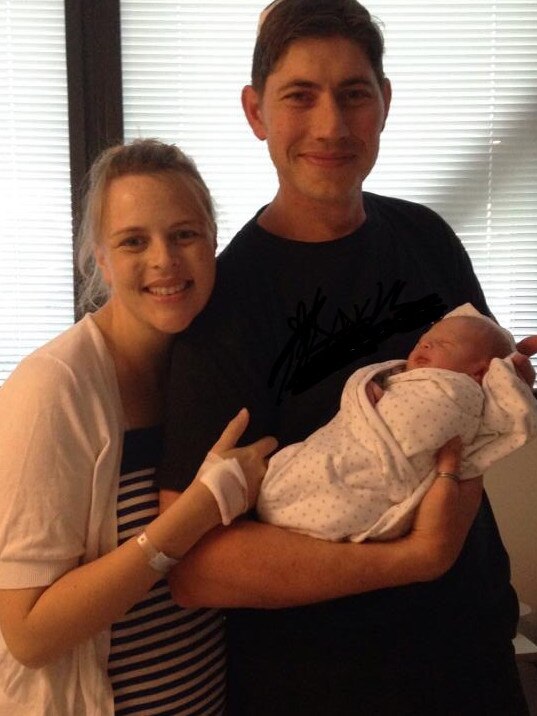 Cathie and Paul Thomas with their newborn son James. Picture: Supplied 