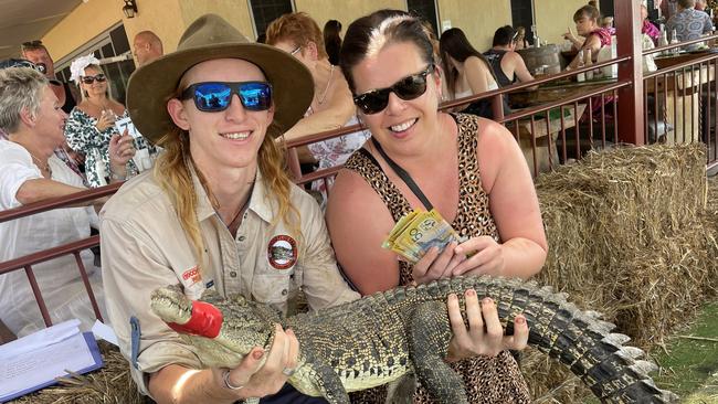 Croc wrangler Payton Prosser and Tracy McMorrow, the winner of the second race with Croc-a-shit at the 2022 Berry Springs croc races. Picture: Glenn Campbell