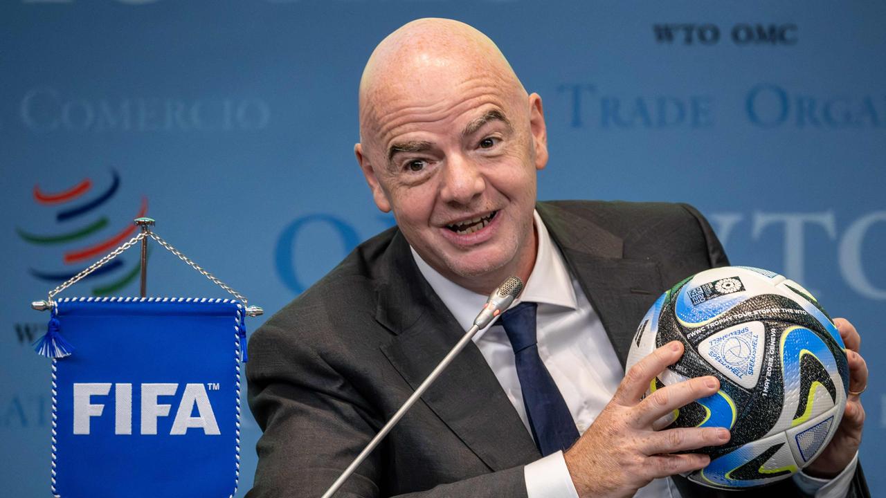 FIFA President Gianni Infantino holds an official ball of the 2023 FIFA Women's World Cup during the "Making trade score for women!" discussion on the use of football as a tool for trade and development at the WTO headquarters in Geneva, on May 1, 2023. (Photo by Fabrice COFFRINI / AFP)