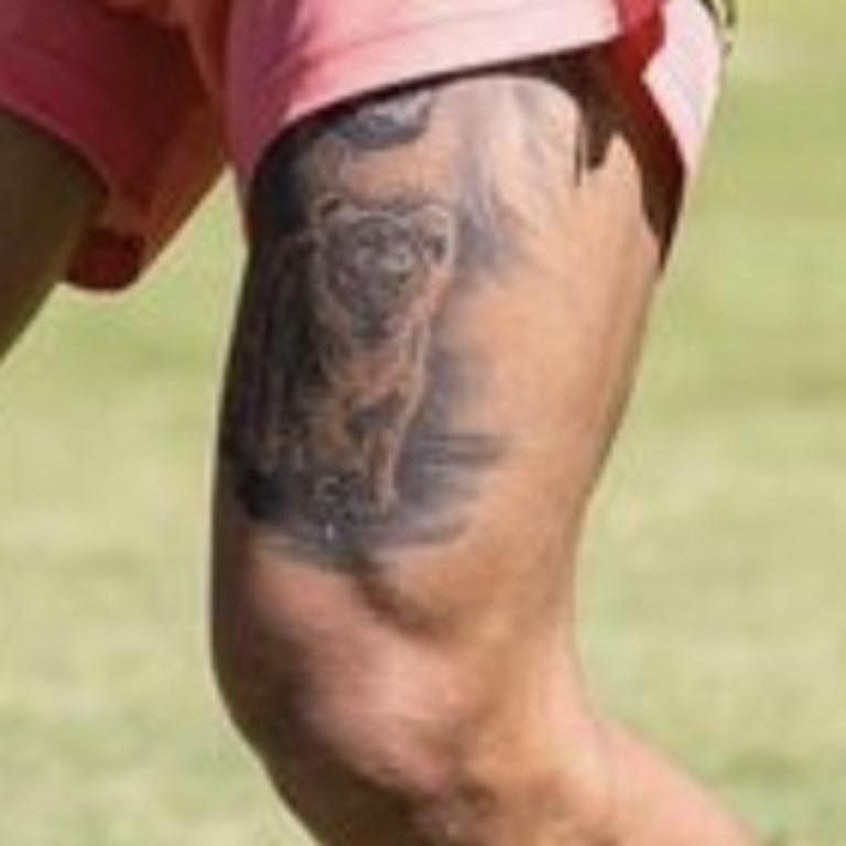 Walsh’s tiger tattoo.