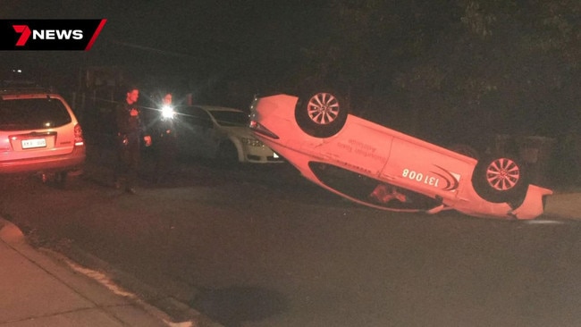 A taxi driver lost his licence on early Tuesday morning after crashing his car in a rollover, and then allegedly refused to take a breath test. Picture: 7NEWS