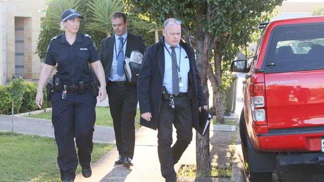 Police and crime scene investigators at the scene of a house fire at Calendar Street, Woodville West. Picture: Emma Brasier.