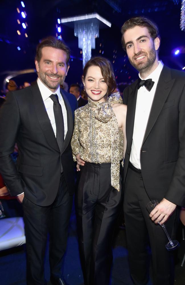 Emma Stone (centre) pictured with her husband Dave McCary (right) and US actor Bradley Cooper (left). Picture: Dimitrios Kambouris/Getty Images for Turner