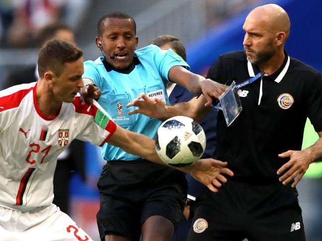 SAMARA, RUSSIA - JUNE 17:  Nemanja Matic of Serbia tries to get the ball from Costa Rica coach Luis Marin as fourth official tries to step in during the 2018 FIFA World Cup Russia group E match between Costa Rica and Serbia at Samara Arena on June 17, 2018 in Samara, Russia.  (Photo by Michael Steele/Getty Images)