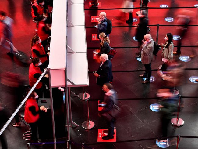 Visitors arrive on the opening day of the MWC (Mobile World Congress) in Barcelona on February 28, 2022. - The world's biggest mobile fair is held from February 28 to March 3, 2022. (Photo by Pau BARRENA / AFP)