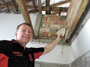 Maryborough home owner Nick Buxton found an old autograph book in the roof of his bathroom while renovating. Picture: Boni Holmes