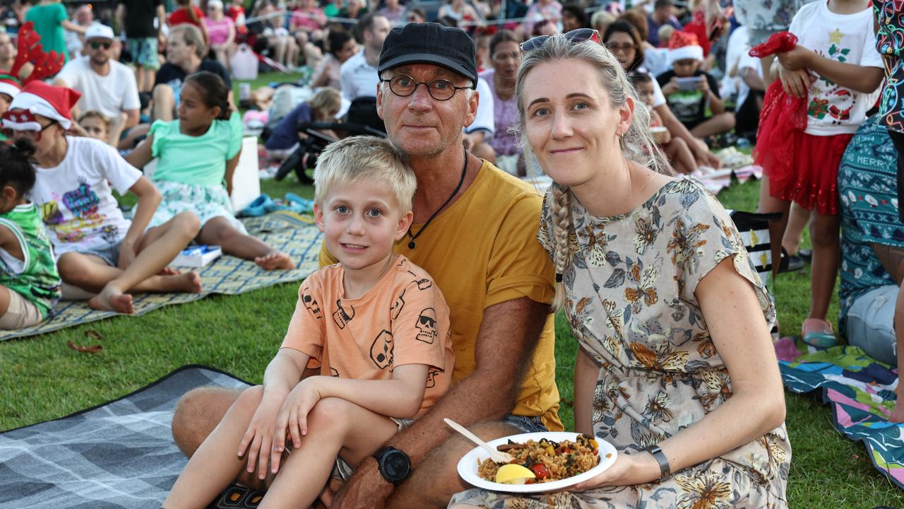 Ivey Dekker, 5, Mike Bornschlegl and Maddie Bornschlegl at the Carols in the Park, held at Munro Martin Parklands. Picture: Brendan Radke