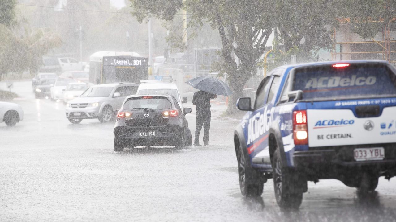 Streets are flooding around Brisbane as storm hits the city on Friday afternoon. Crosby Rd, Hamilton, Brisbane, 13th of December 2019. (AAP Image/Attila Csaszar)