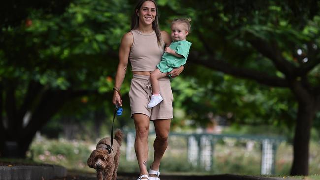 Katrina Gorry and her daughter Harper take dog Rio for a walk around New Farm Park in Brisbane. Picture: Lyndon Mechielsen