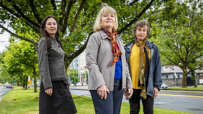 Bea McNicholas, Fiona Bell and Jill Quirk with plane trees in St Kilda Rd. Picture: Jake Nowakowski