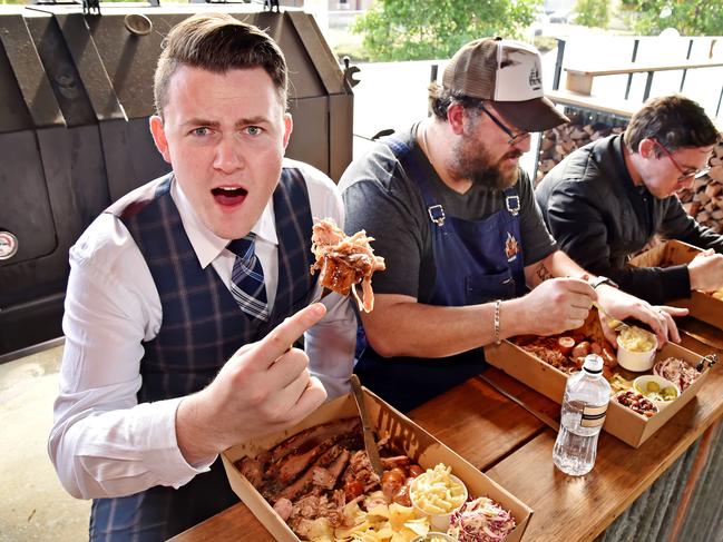 Hills Shire Times reporters Jake McCallum (L) & Gary Hamilton-Irvine (R) take on chef Brad Shorten (C) in the Brimstone Feast challenge at Castle Hill on Tuesday July 31st. Hills Shire Times reporters Jake McCallum & Gary Hamilton-Irvine took on Fire & Brimstone chef Brad Shorten in the Brimstone Feast challenge at the Hillside Hotel, undertaking the challenge of eating 2kg of brisket, pork, hot links, slaw, mac ÔnÕ cheese, beans, pickle and crisps in under 15 minutes. (AAP IMAGE / Troy Snook)