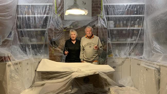 Over it: Pam and Arthur Tombs in their kitchen. Picture: Cassandra Tombs