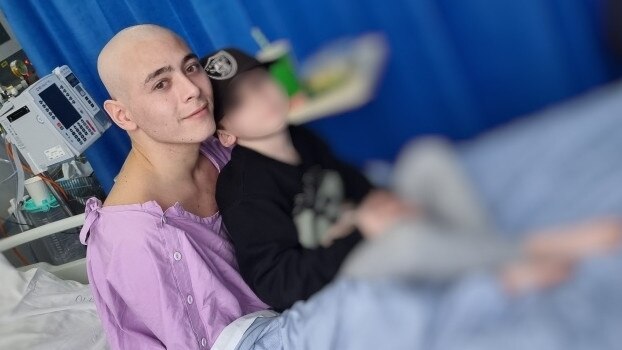 Young Ipswich dad Gino Andre Buchholz-Ale in custody during a hospital visit with his only son while being treated for a rare blood cancer.