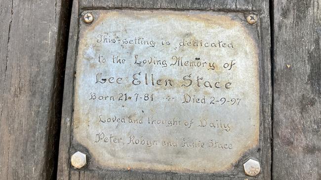 A plaque on the table Mr and Ms Stace set up to honour their daughter.