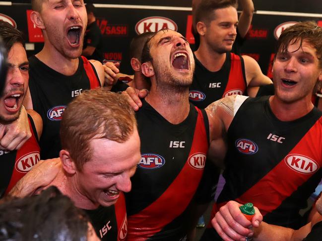 AFL Round 1 Essendon vs. Hawthorn at the MCG. Jobe Watson enjoys belting out the song after tonights win .Pic : Michael Klein
