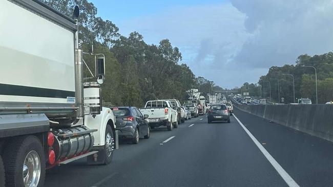 Queensland Fire and Emergency services called to truck crash on M1 after driver fell asleep. Photo: Nathan Rogers