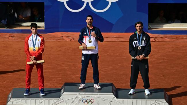 The tennis singles top three after receiving their medals. Picture: AFP