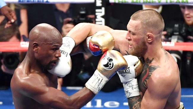 Floyd Mayweather and Jr. Conor McGregor battle in the sixth round of their super welterweight boxing in 2017