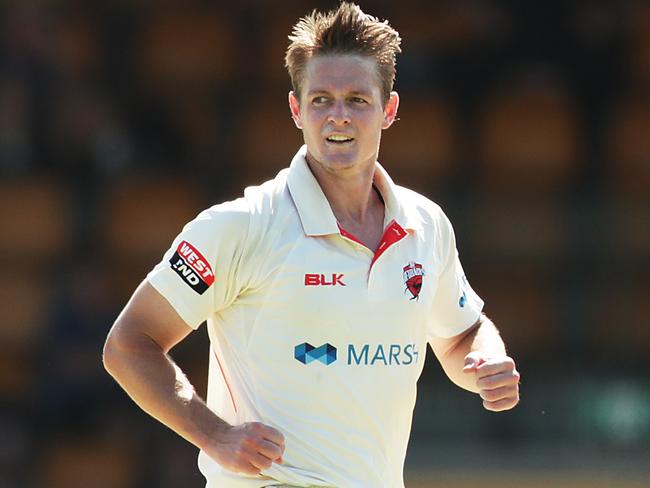 SYDNEY, AUSTRALIA - FEBRUARY 24: Joe Mennie of the Redbacks celebrates after taking the wicket of Daniel Hughes of the Blues during day one of the Sheffield Shield match between New South Wales and South Australia at Bankstown Oval on February 24, 2020 in Sydney, Australia. (Photo by Mark Metcalfe/Getty Images)