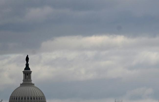 The dome of the US Capitol is seen on a cloudy day in Washington, DC in January 2024