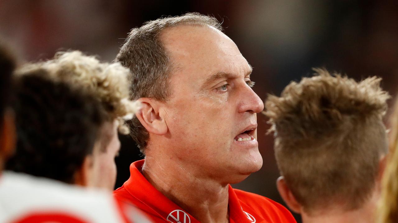 MELBOURNE, AUSTRALIA - MARCH 31: John Longmire, Senior Coach of the Swans addresses his players during the 2022 AFL Round 03 match between the Western Bulldogs and the Sydney Swans at Marvel Stadium on March 31, 2022 In Melbourne, Australia. (Photo by Dylan Burns/AFL Photos via Getty Images)