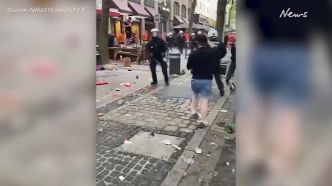 Moment England soccer fans are attacked by Netherlands supporters outside Euros semi