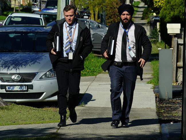 Homicide Squad detectives investigate on the scene of the shooting in Hampton Park. Picture: Luis Enrique Ascui