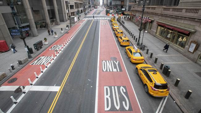 Yellow cabs wait for passengers outside Grand Central Terminal on a deserted 42nd Street in New York on Wednesday. Picture: AP