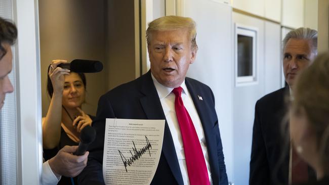 Donald Trump on Air Force One on Sunday. Picture: AP