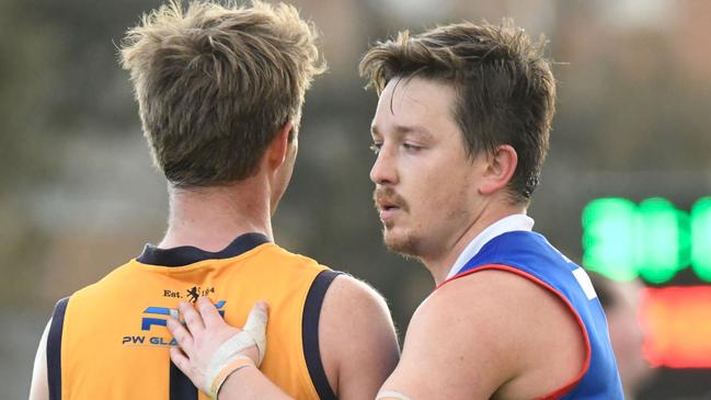 Strathmore's Andrew Horne and Keilor's Dylan Joyce after the final siren. Picture: Jamie Morey