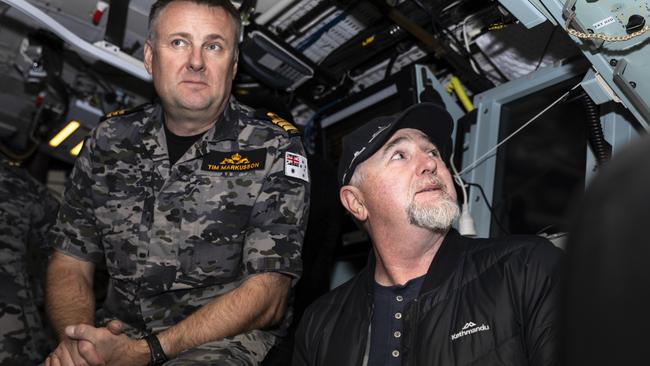 Commanding Officer of HMAS Sheean, Commander Tim Markusson, sits with Mr Dennis Sheean (right), great nephew of Ordinary Seaman Edward ‘Teddy’ Sheean, VC, in HMAS Sheean's control room during a sea-ride off Tasmania's north coast. Picture: LS Daniel Goodman/ Australian Defence Force