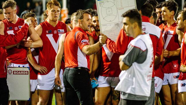 North Adelaide coach Jacob Surjan addresses his players at quarter-time at The Parade on Friday night. Picture: Morgan Sette