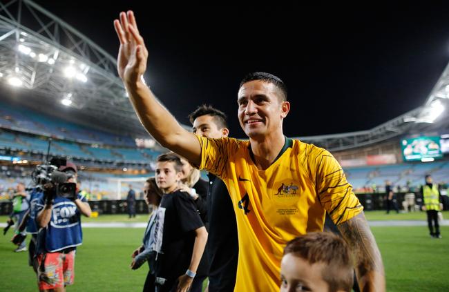 Australia's Tim Cahill waves to fans as he walks around the stadium after his international retirement. Picture: David Moir