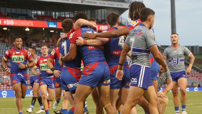 NEWCASTLE, AUSTRALIA - FEBRUARY 21: Knights players celebrate a try from Jirah Momoisea during the NRL Trial match between the Canterbury Bulldogs and the Newcastle Knights at McDonald Jones Stadium on February 21, 2022 in Newcastle, Australia. (Photo by Ashley Feder/Getty Images)