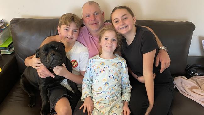 Sean Adams with his children (L-R) Cameron Adams, Maggie Moran and Georgia Adams and his dog Bongo. Picture: Supplied