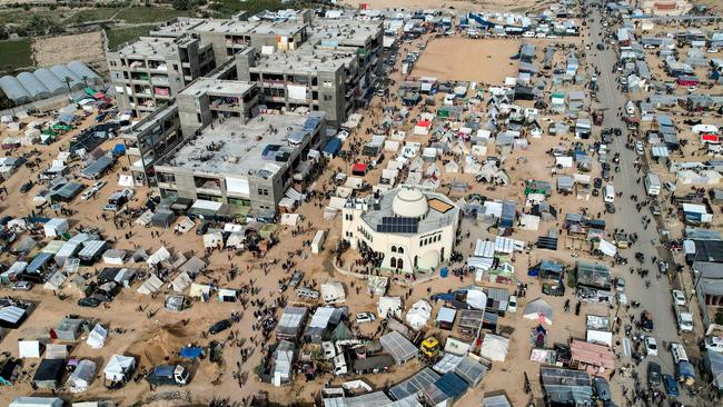 The makeshift tent camps housing Palestinians displaced by intense Israeli bombardment on the Gaza Strip seeking refuge in open areas around the Raed al-Attar Mosque in Rafah, near the Egyptian border. Picture: AFP