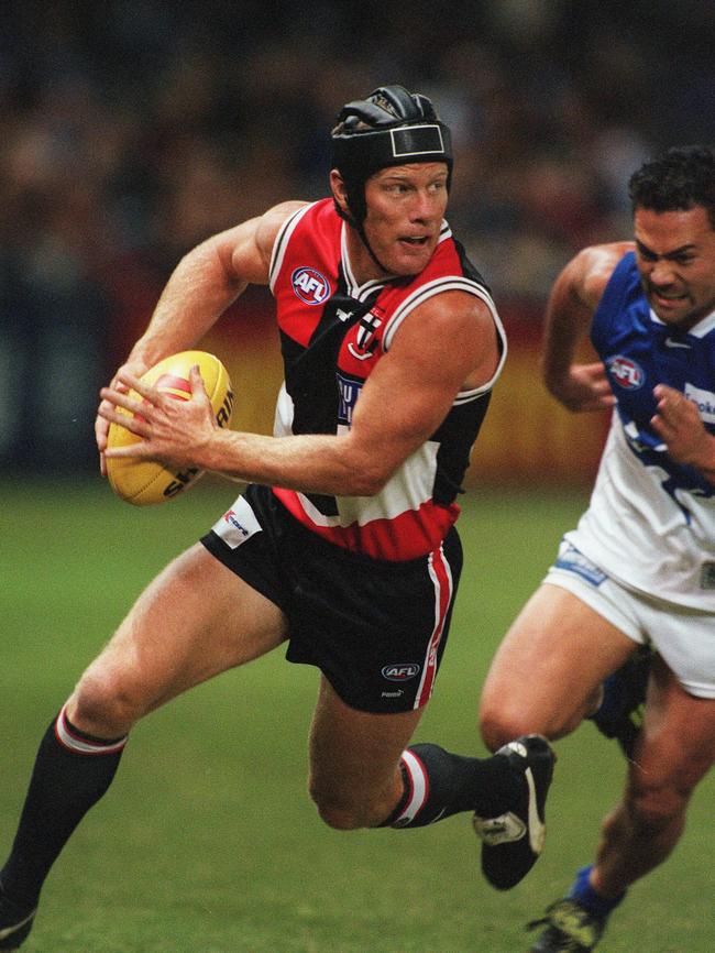 Burke against North Melbourne in 2000, he was one of the toughest players of his generation.