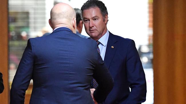 Queensland LNP leadership contender John-Paul Langbroek (right) is seen leaving a party room meeting at Parliament House after Deb Frecklington gains the leadership. (AAP Image/Dan Peled)