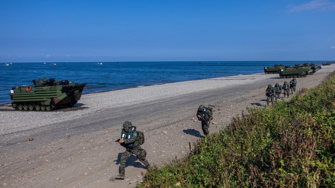 Soldiers disembark from AAV7 amphibious assault vehicles during five days of live fire drills involving all forces of the military to repel simulated attacks from China. Picture: Annabelle Chih/Getty Images