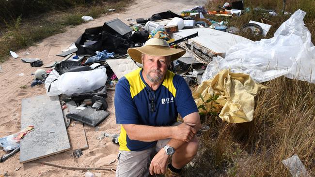 Pictured on state land, David Dudley, TIDY UP Townsville Coordinator, has had enough of the illegal dumping around Townsville. Picture: Shae Beplate.