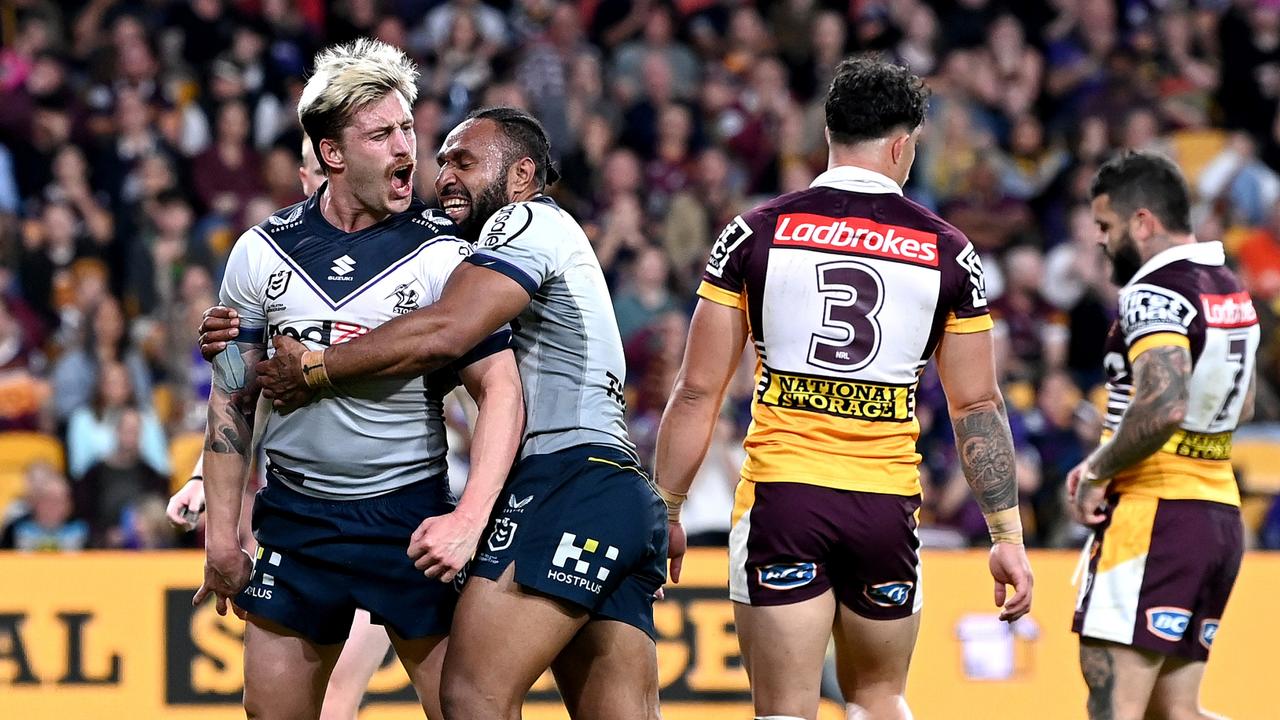 BRISBANE, AUSTRALIA - AUGUST 19: Cameron Munster of the Storm celebrates scoring a try during the round 23 NRL match between the Brisbane Broncos and the Melbourne Storm at Suncorp Stadium, on August 19, 2022, in Brisbane, Australia. (Photo by Bradley Kanaris/Getty Images)