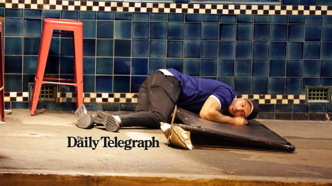 Nightie night! A Bulldogs player has a nap after a wild day and night out. Picture: Christian Gilles