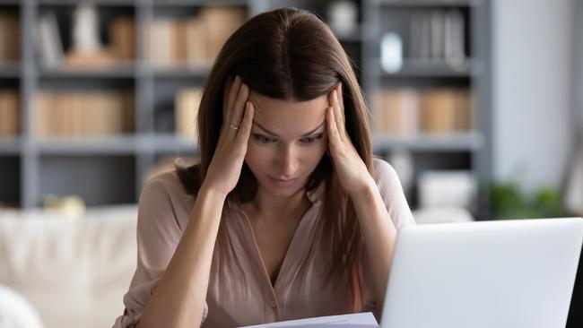 MONEY ISTOCK -  Stressed young woman holding head in hands, feeling desperate about financial problems, dismissive notice, failed test. Depressed businesswoman shocked by bank loan rejection, domestic bills. Picture: Istock